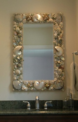 polished green and white seashell and nautilus mirror